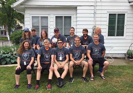 The Harper/Big Springs youth group in front of their house at Lakeside